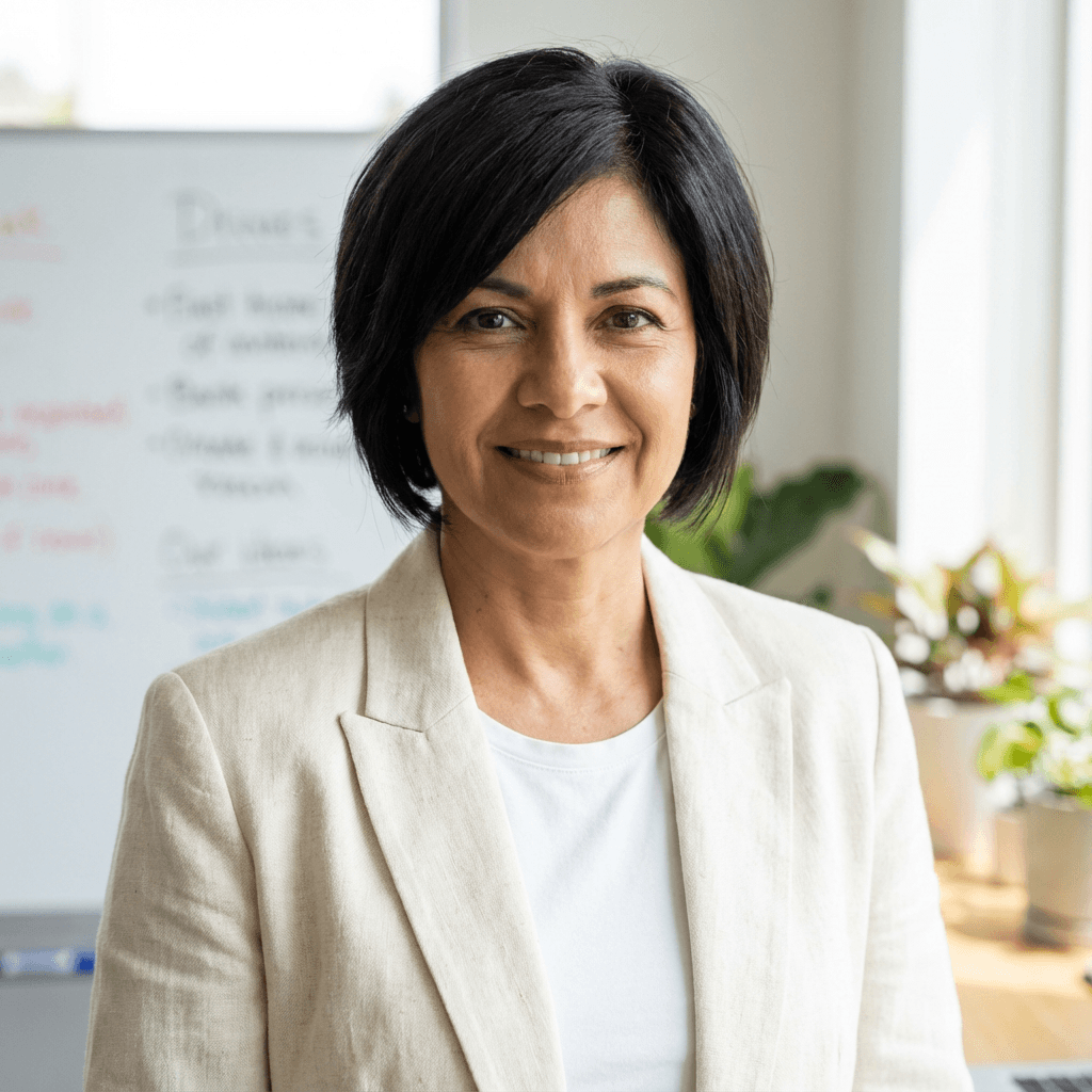 Maria Gonzalez, case manager, smiling warmly in an office setting